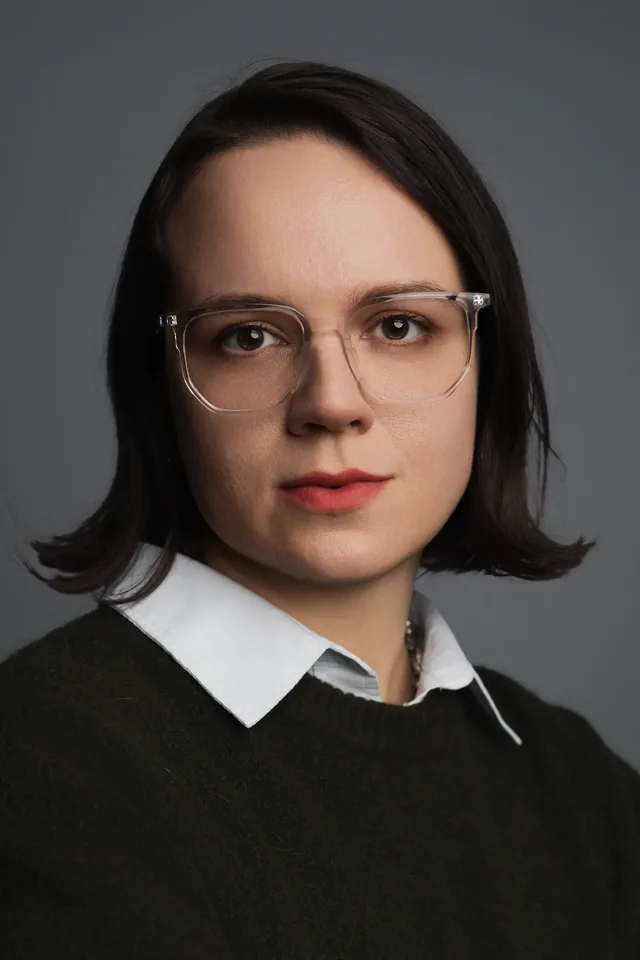 Portrait in glasses looking directly at the camera.