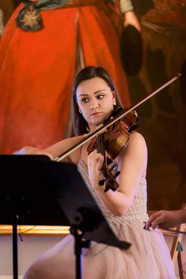 Close-up of a violinist playing.